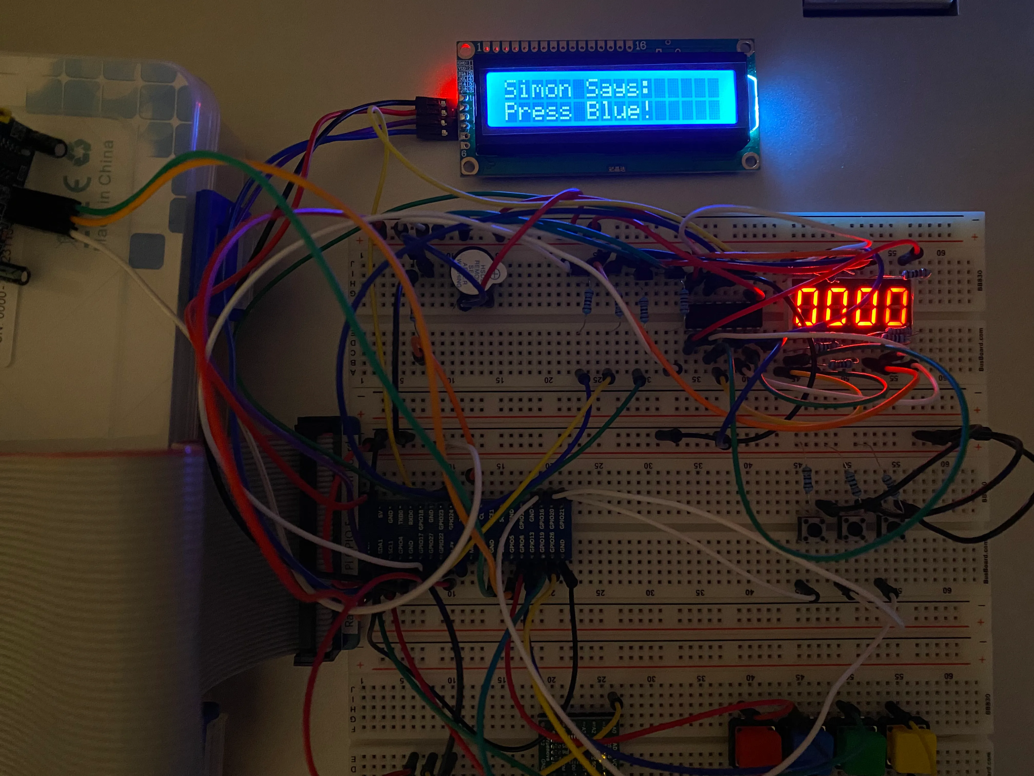 A breadboard with a two row LCD screen and various inputs